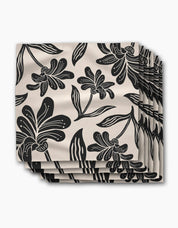 Stack of Giant Lush Floral dinner napkins, oversized black brushstroke flowers on a cream ground