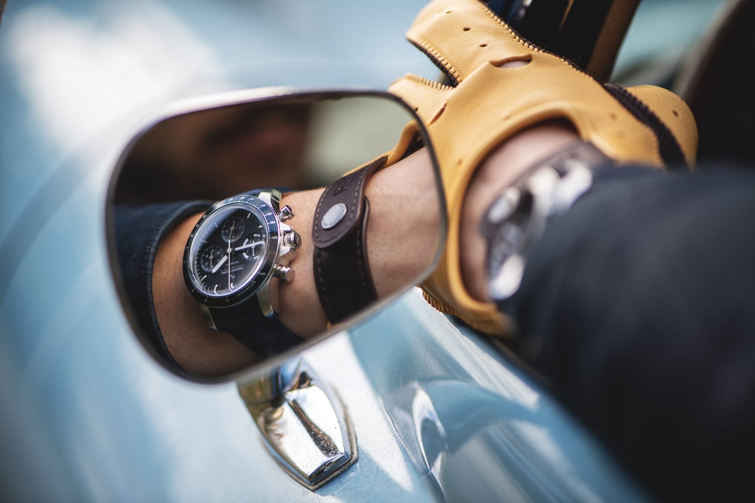 1960 Racing Chronograph reflected in classic car mirror