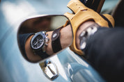 1960 Racing Chronograph reflected in classic car mirror