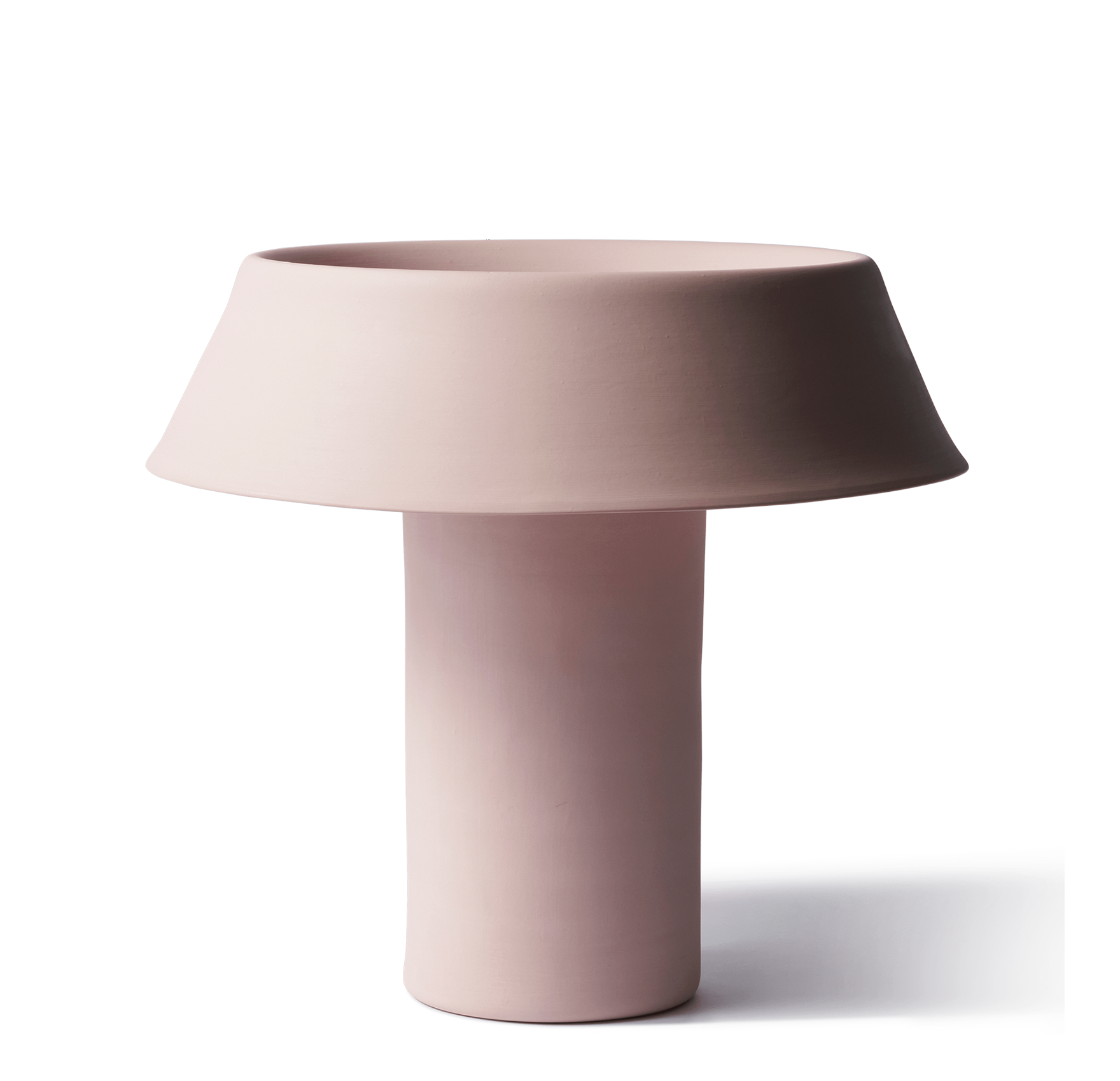 Flared Table Lamp in Blossom, a soft pink handmade porcelain lamp with a wide flared shade on a cylindrical base