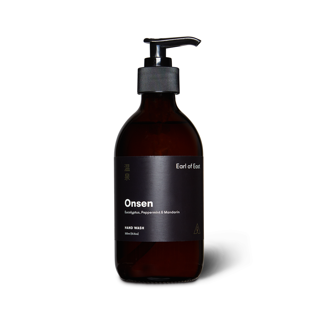 Earl of East Onsen hand wash in an amber glass bottle with a black pump