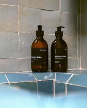 Earl of East Shinrin-Yoku hand balm and hand wash on a tiled bathroom ledge