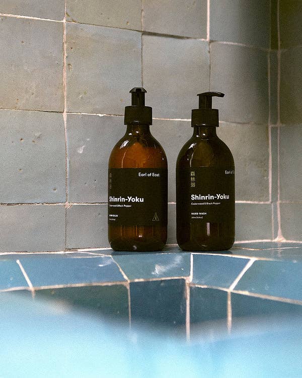 Earl of East Shinrin-Yoku hand balm and hand wash on a tiled bathroom ledge