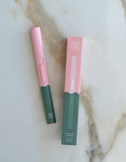 Botanica Flameless Rechargeable Lighter in Beverly Hills, pink barrel with a green base, shown with packaging