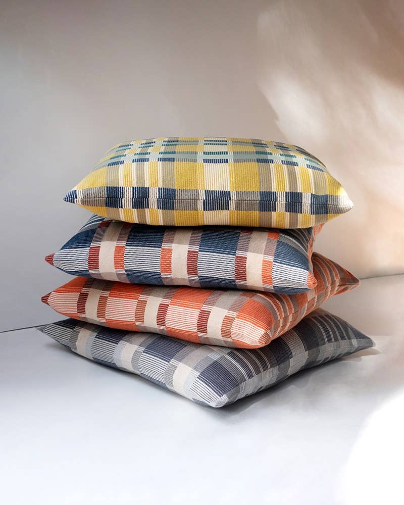 Mungo Skipping Block Cushions stacked, showing the depth of the filled cushions