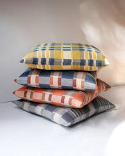 Mungo Skipping Block Cushions stacked, showing the depth of the filled cushions