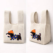Cream open-knit handbag with an embroidered dachshund patch in an orange hat, shown from the front and side