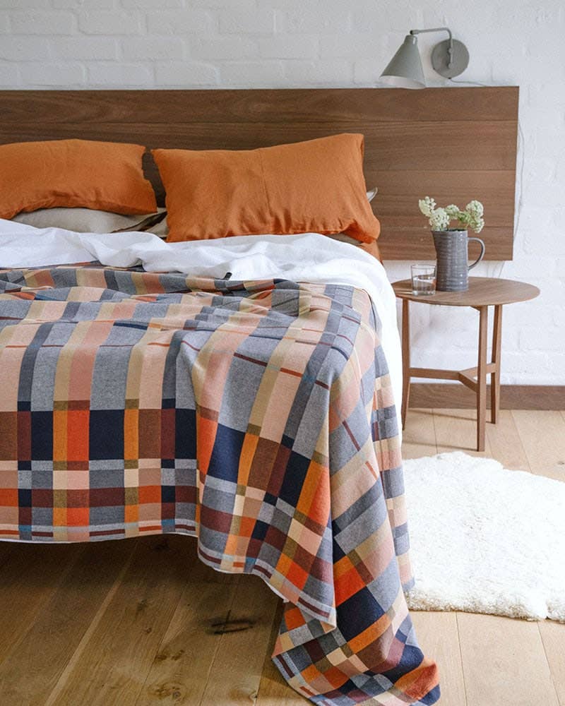 Mungo Double Cloth Queen Blanket styled across a bed, showing the queen scale