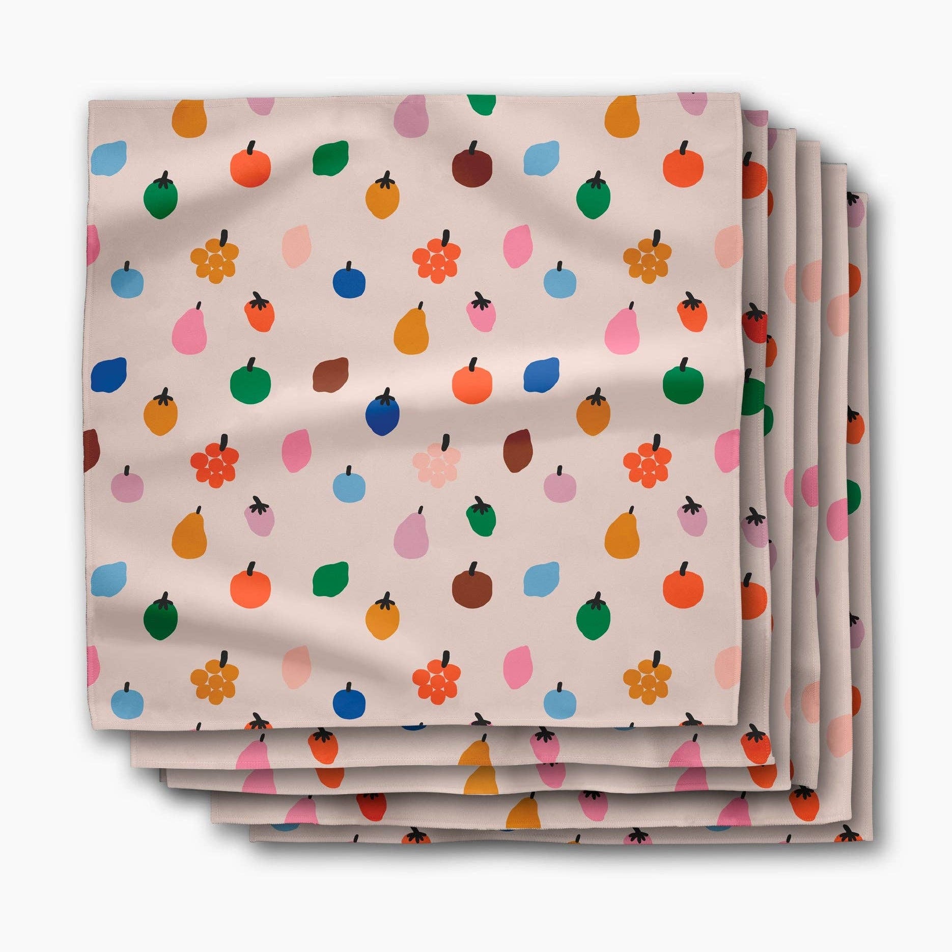 Stack of Fruit Basket dinner napkins, small apples, pears and blossoms on a pale blush ground