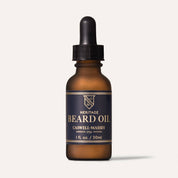 Caswell-Massey Heritage Beard Oil in a 1 fl oz amber glass bottle with a black dropper and navy label