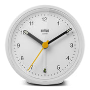 Braun BC12 Round Alarm Clock in white, with yellow second hand and green alarm indicator