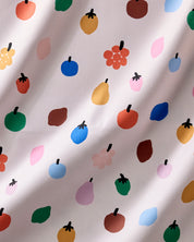 Close-up of the Fruit Basket print, stylized fruit shapes in red, green, blue, yellow and pink