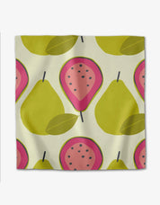 Tropical Fruit napkin with chartreuse pears and halved pink guavas on off-white