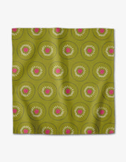 Tropical Fruit napkin with a repeating kiwi slice pattern on an olive ground