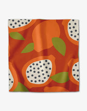 Tropical Fruit napkin with an abstract fruit print in orange, green and cream on white