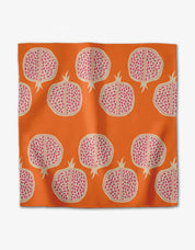 Tropical Fruit napkin with sliced pomegranates in pink and beige on orange