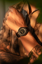 1956 Marine Black Gilt on wrist in warm light