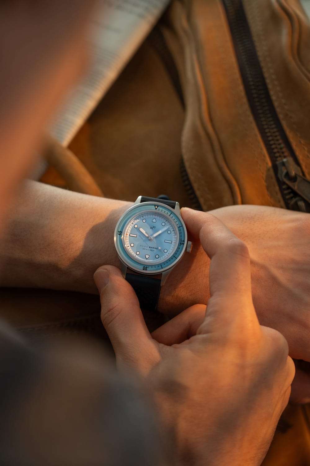 1956 Marine Steel Light Blue on wrist with leather strap