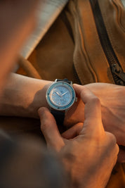 1956 Marine Steel Light Blue on wrist with leather strap