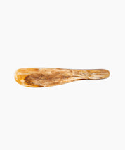 Temple Cake Knife in Light Horn by Dinosaur Designs, hand-cast resin