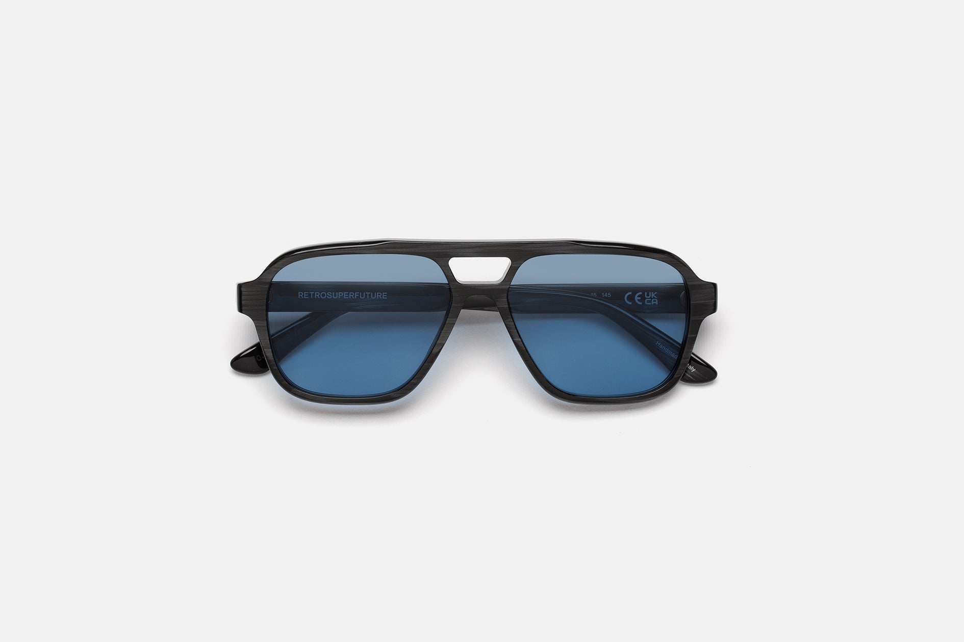 RETROSUPERFUTURE Maneval in Black Cat, striated black acetate with blue Zeiss lenses