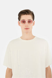 Model wearing Lunettes 4 in Pearl Sand