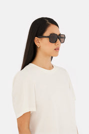 Model wearing MM6 Maison Margiela Lunettes 4 in Havana, side view