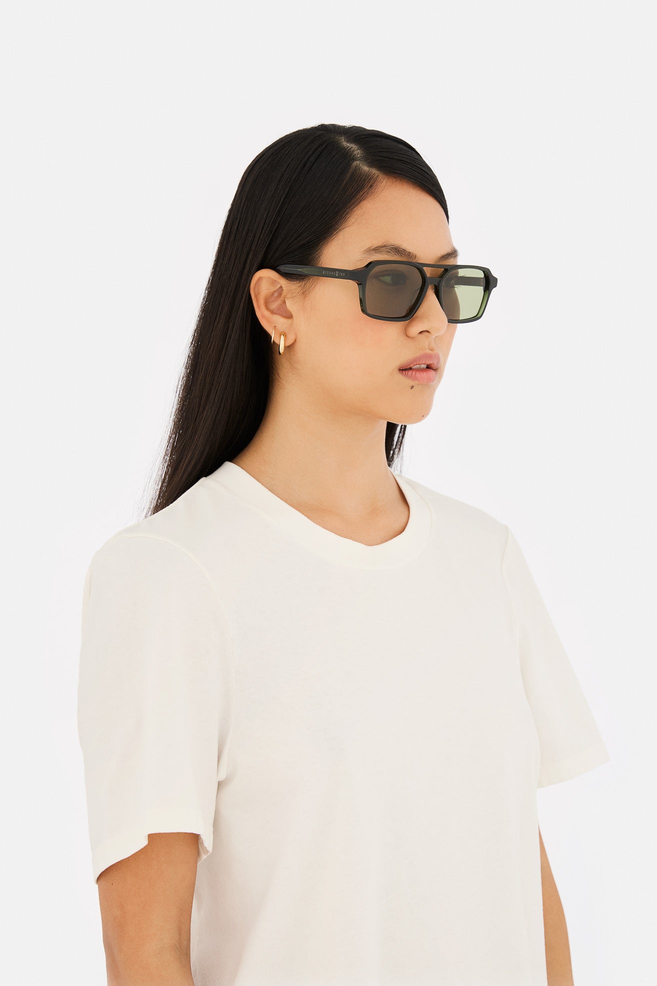 Model wearing Lunettes 7 in Green, side view