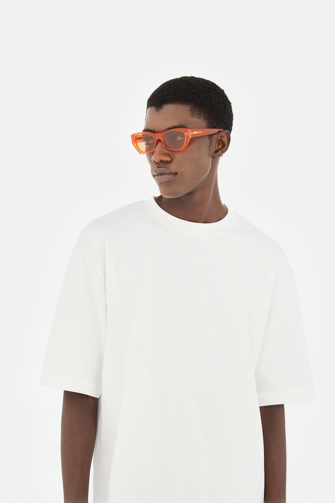 Model wearing Amata Estate in Mandarino, side view