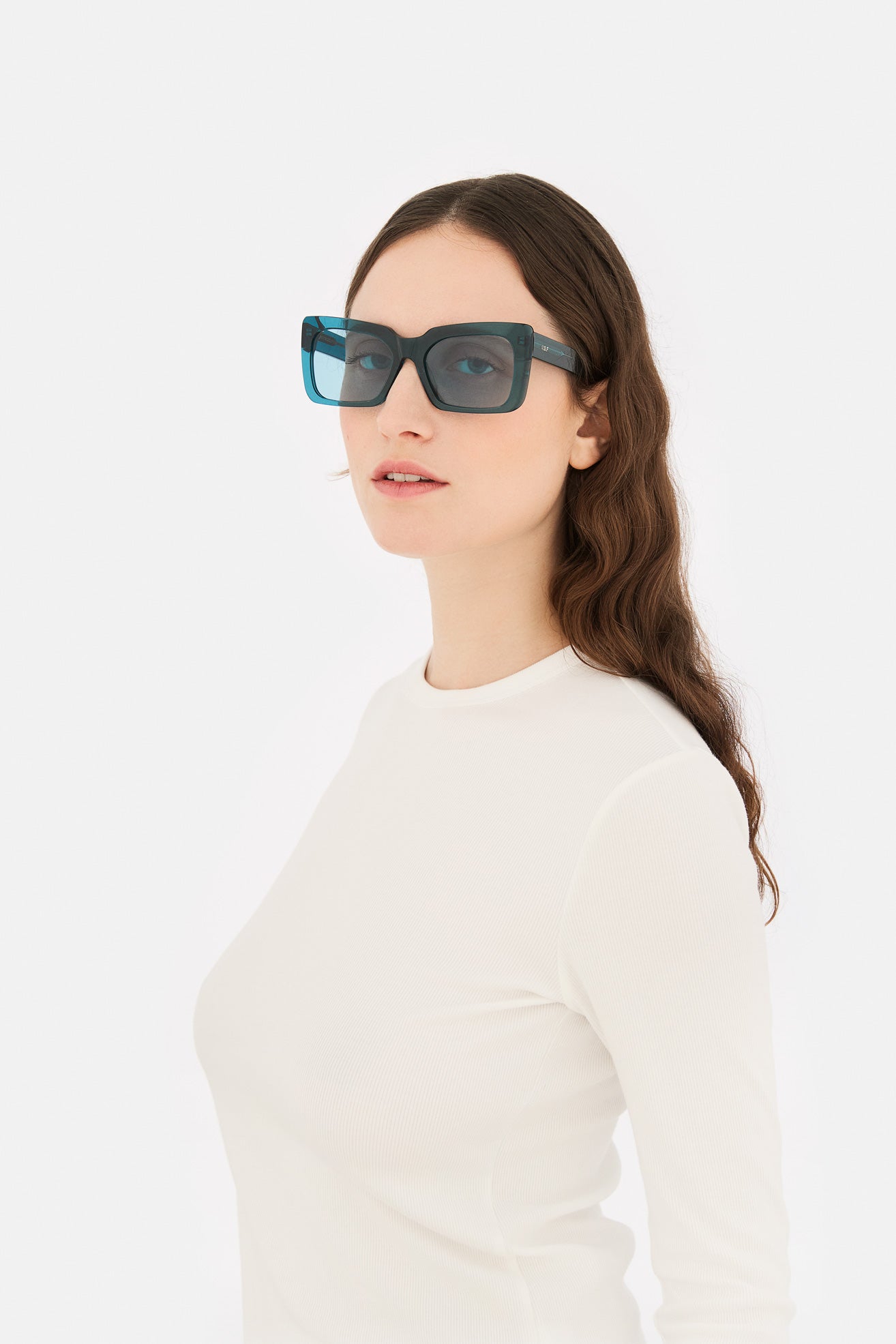 Model wearing Senta in Teal, side view