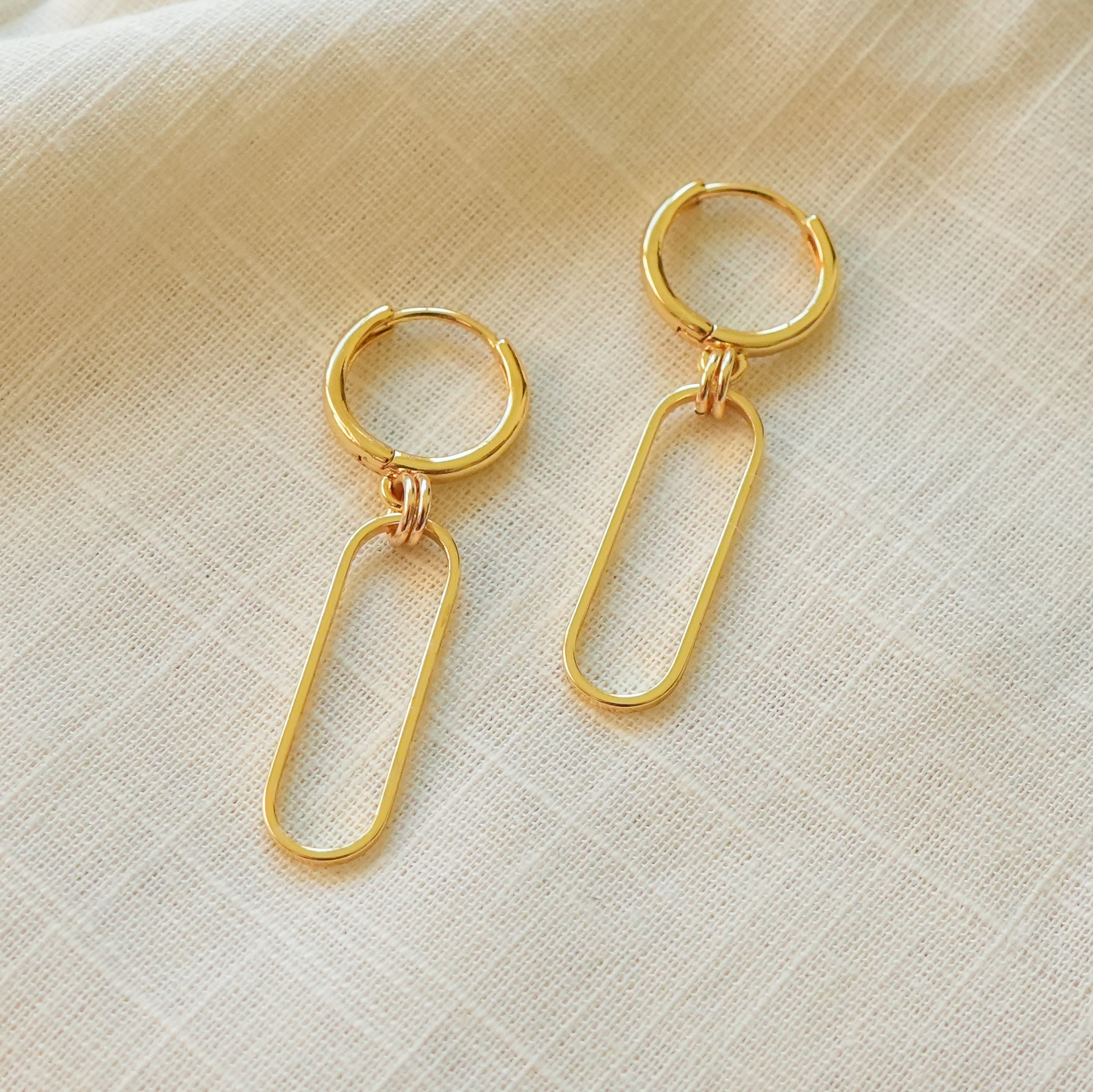 So Niice Reach Earrings, gold link hanging from a huggie hoop