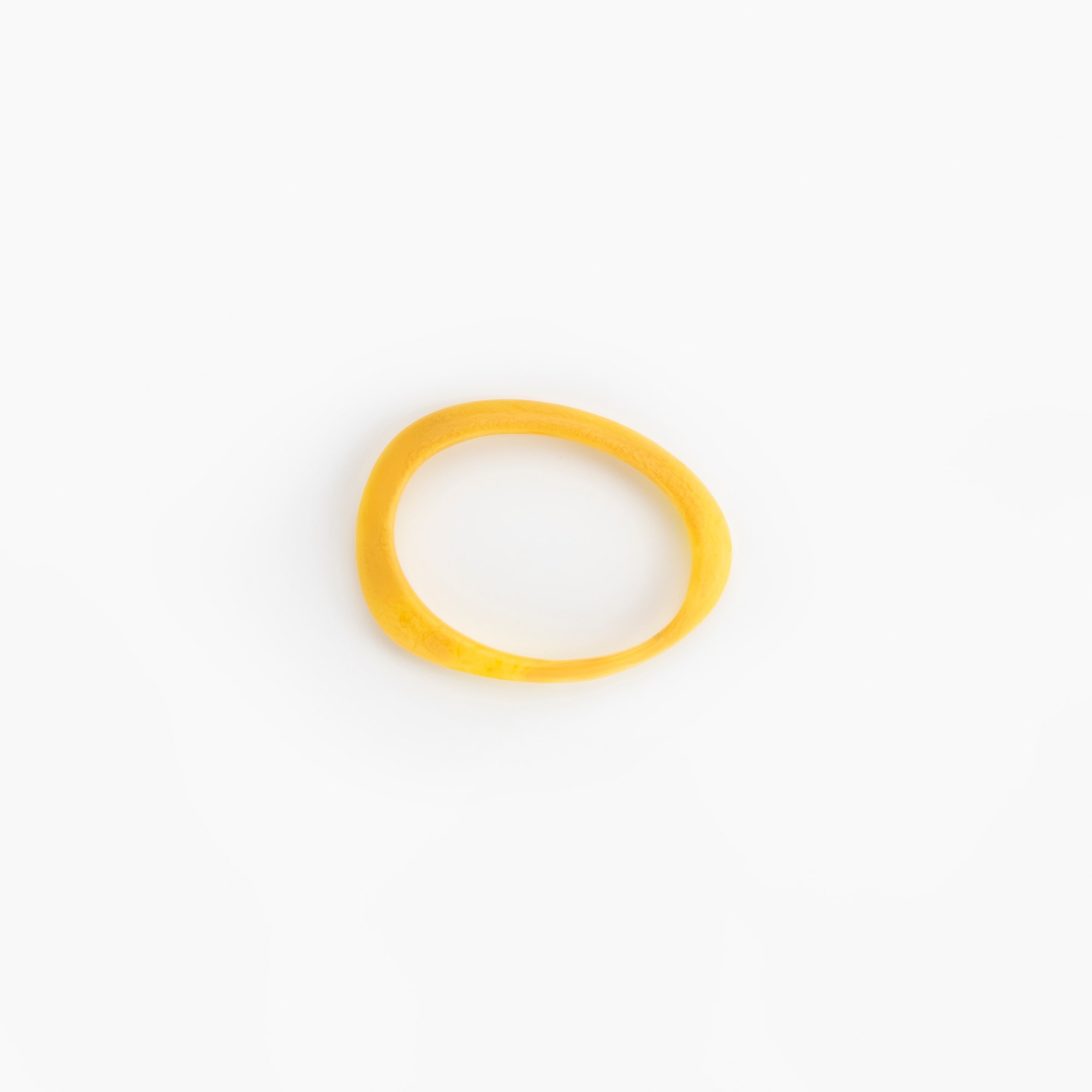 Rock Wishbone Bangle Narrow in Honeycomb by Dinosaur Designs, hand-cast resin