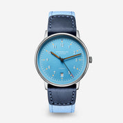 Sternglas Lumatik in Light Blue, light blue dial with orange accents on a light blue nylon strap