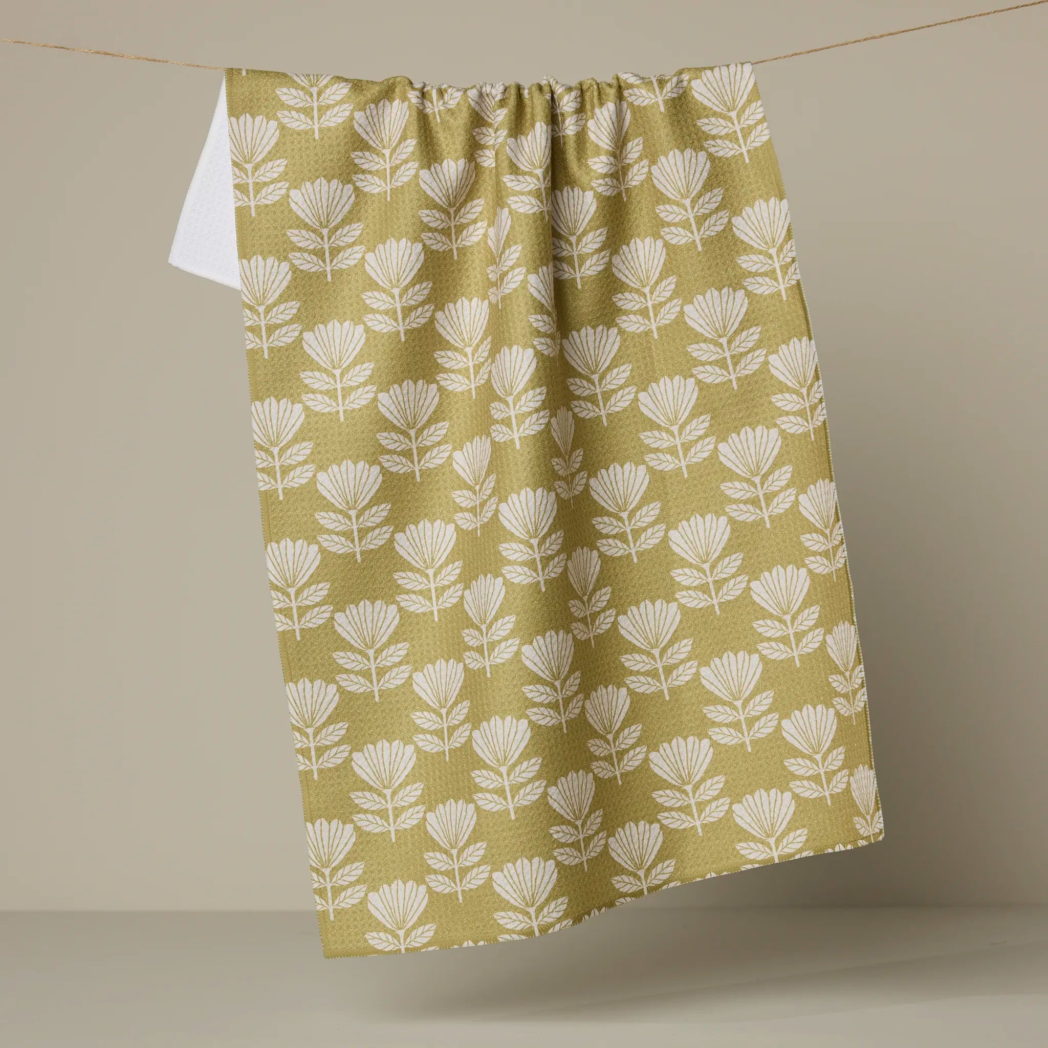 Geometry Ingrid kitchen tea towel, cream fan-shaped blooms on a chartreuse ground
