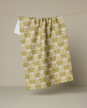 Geometry Ingrid kitchen tea towel, cream fan-shaped blooms on a chartreuse ground
