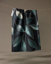 Geometry Modern Organic kitchen tea towel, sage and seafoam leaves on a near-black ground