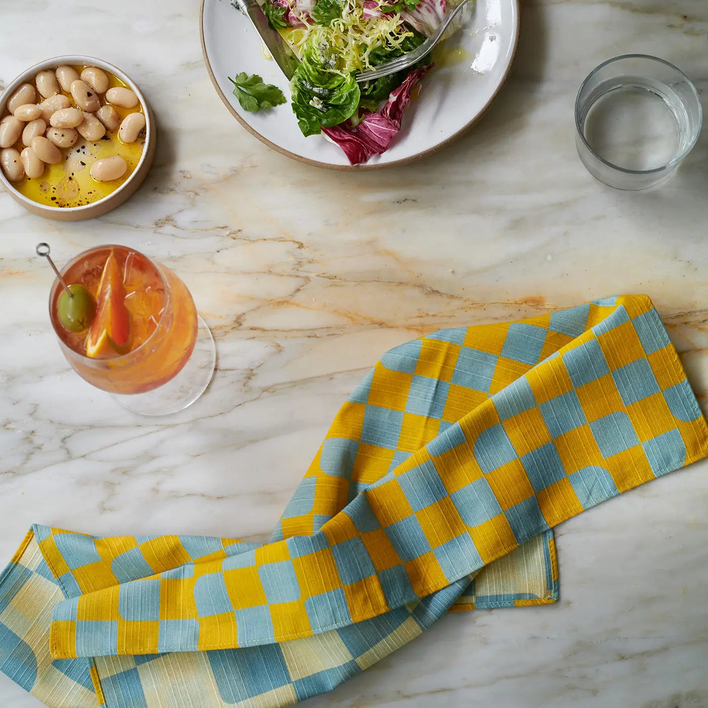 Tortuga_Forma_Dinner_Napkin_Check_Sky_2.webp
