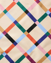 Close-up of the Cool Grid weave, diagonal bands of black, teal, blue, coral and tan on cream