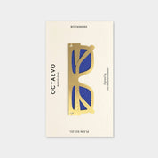 OCTAEVO Plein Soleil bookmark, brass sunglasses shape with blue lenses on its printed card