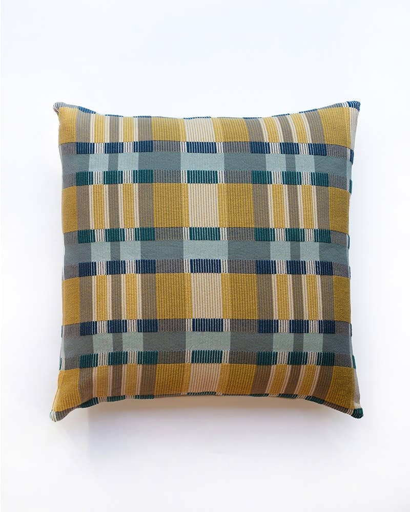 Mungo Skipping Block Cushion in Leapfrog, a mustard, teal and navy Monk's Belt weave