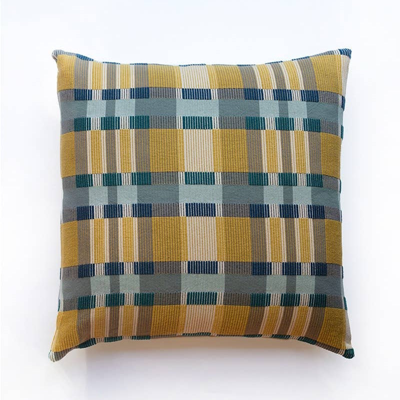 Mungo Skipping Block Cushion in Leapfrog, a mustard, teal and navy Monk's Belt weave