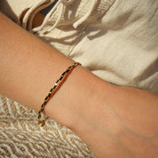 Cause and Effect Bracelet worn on the wrist