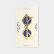 OCTAEVO The Voyage bookmark, brass sunglasses shape with blue lenses on its printed card