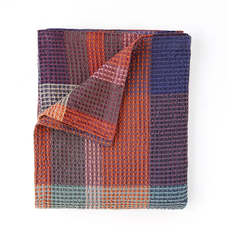 Mungo Vrou-Vrou Queen Blanket in Nebula, a rust, purple and navy waffle weave, folded