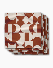 Stack of Circle Playground dinner napkins, terracotta and cream half-circles in a mid-century pattern