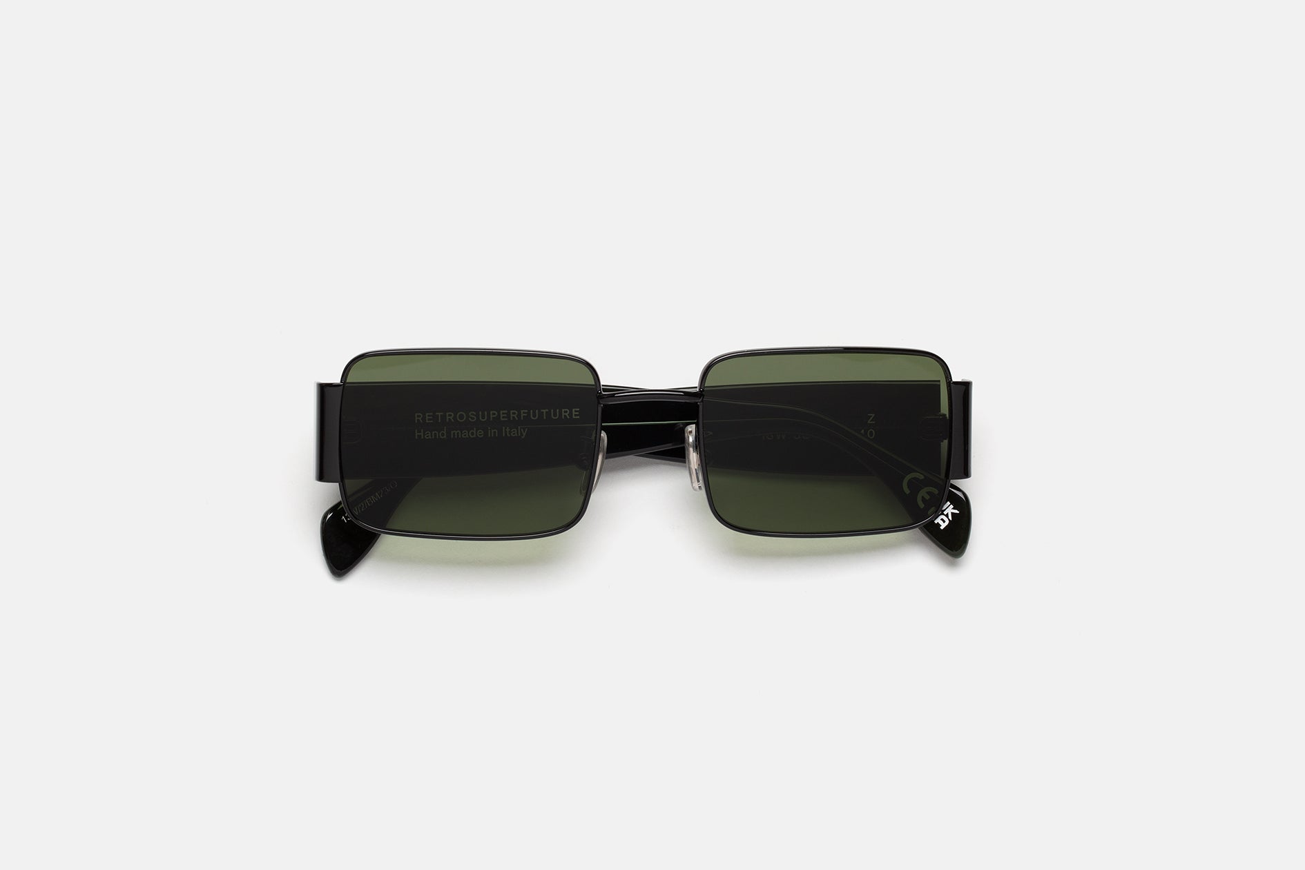 RETROSUPERFUTURE Z in Tartaruga, black metal rims folded, showing the green lenses