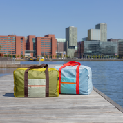 Remember Tom & Liz travel bags on a jetty