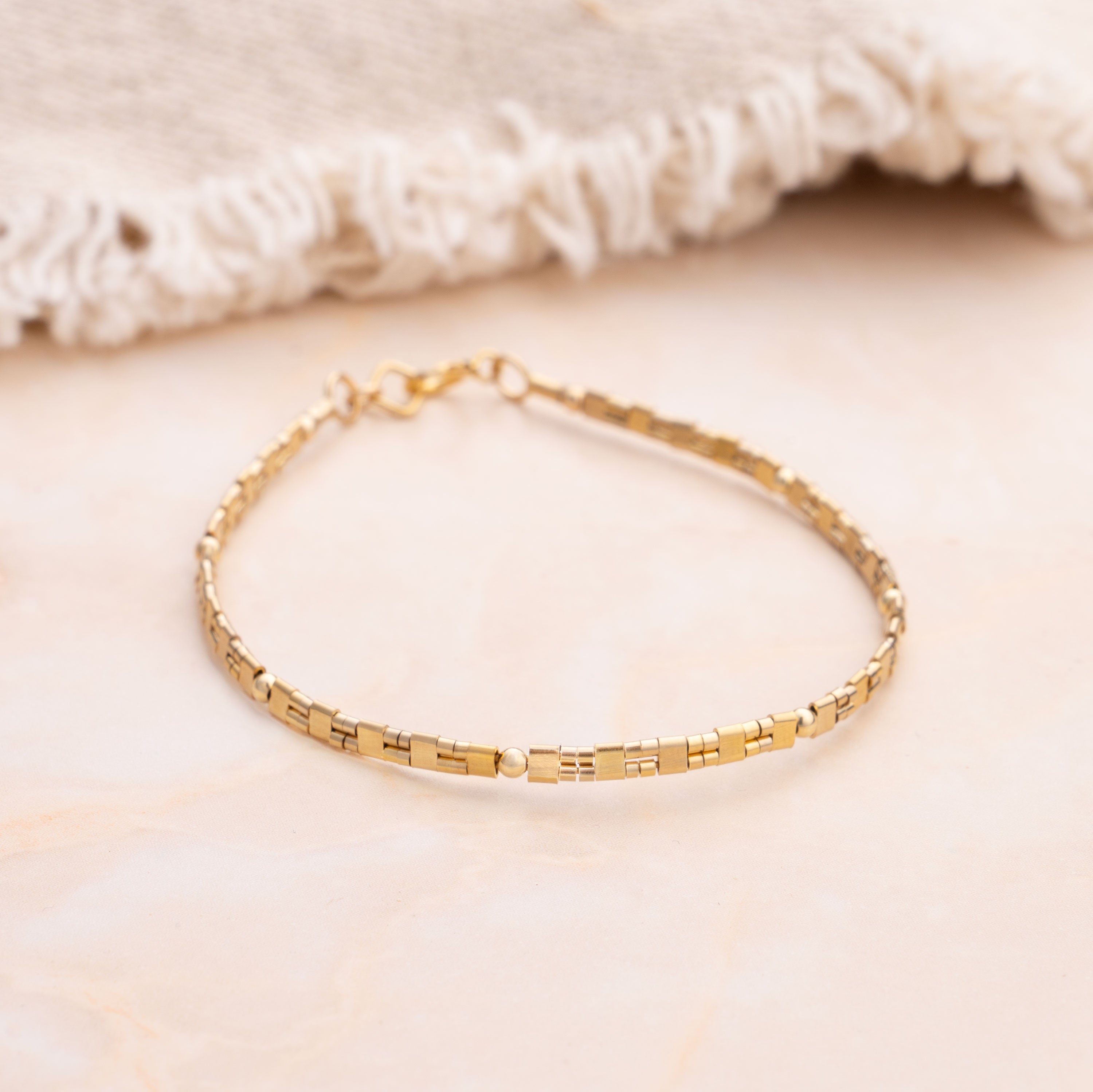 So Niice Generations Bracelet, a 14k gold-filled bangle style bracelet