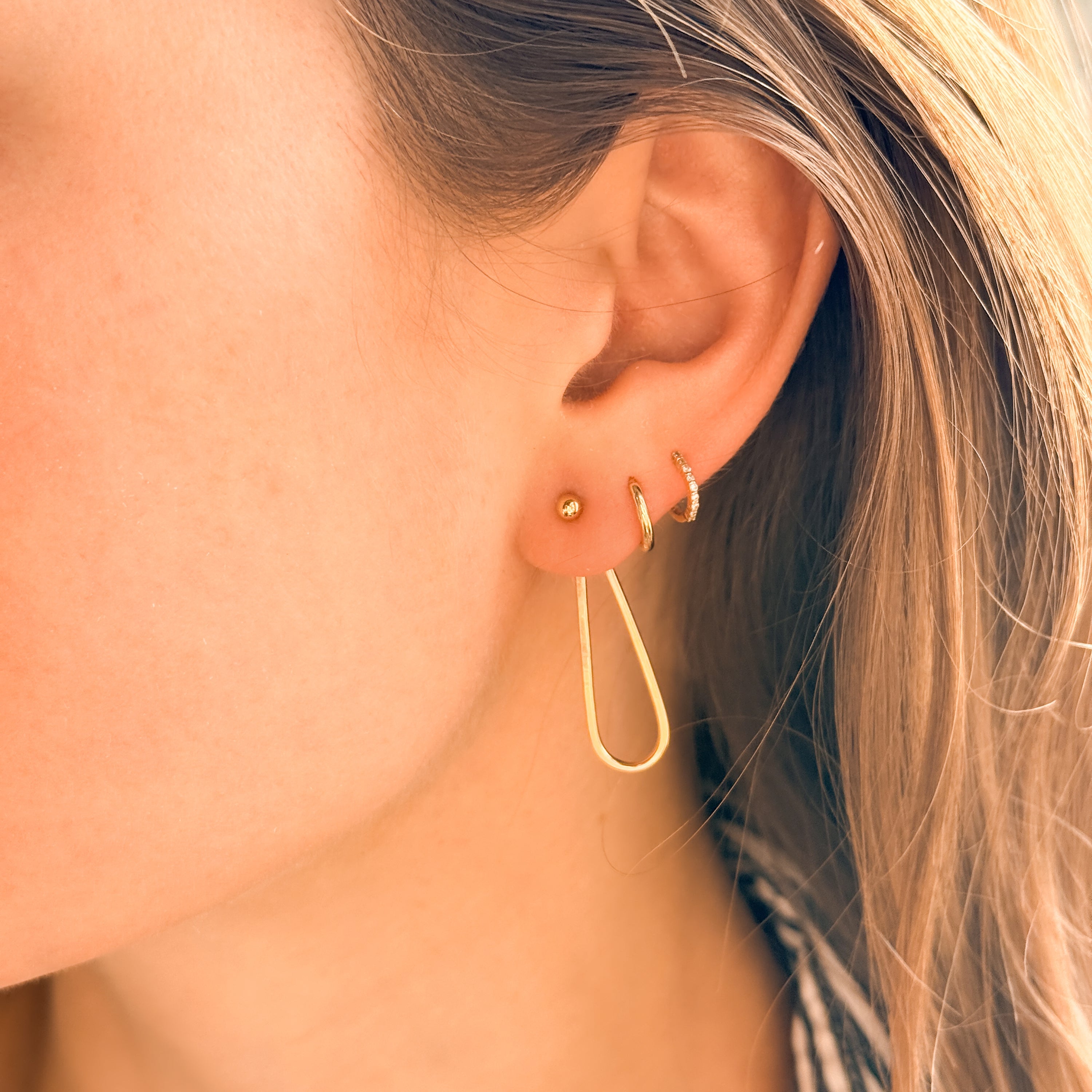 Petalo Earrings worn, showing the two-way design