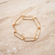 So Niice Reach Bracelet, gold paperclip link with a tiger's eye charm